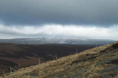 Storm clouds over a snowy Bleaklow