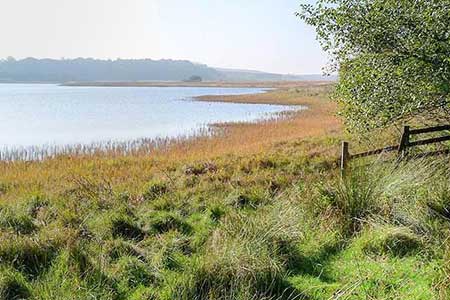 Greenlee Lough lies north of Hadrian's Wall