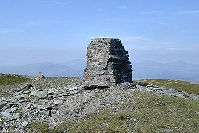 Summit cairn on Rhobell Fawr & view to Rinogs