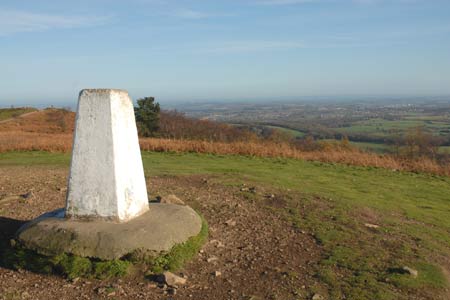 The trig point on the Wrekin and the view east