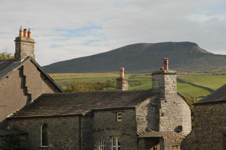 Pen-y-ghent above cottages in Horton in Ribblesdale