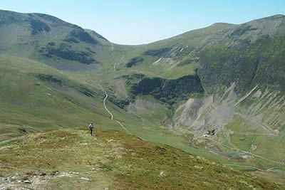 Deserted mine in Coledale is dwarfed by Grisedale Pike