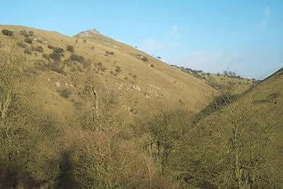 The Sugar Loaf towers above Wetton Mill