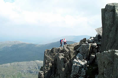 Climbers arriving on Tryfan's summit
