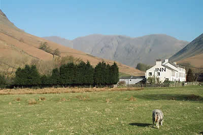 Inn at Wasdale Head with mass of Pillar behind