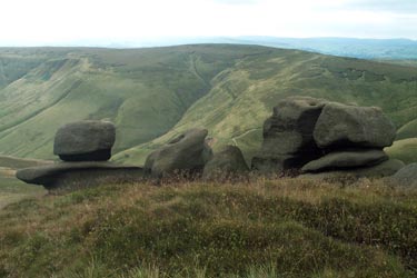 High above Edale are  the rocks that make up the Woolpacks.