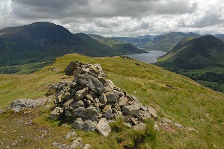 The cairn on Low Fell with Crummock Water as a backdrop