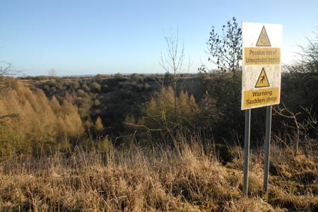 The bomb crater at Fauld with warning signs