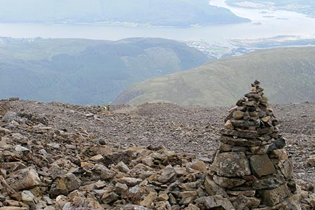 Cairn marking the path near the top of the zig zags.  Fort William and Loch Linnhe are now seen wa