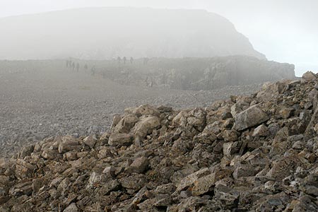 Ben Nevis with ghost-like figures in the gloom