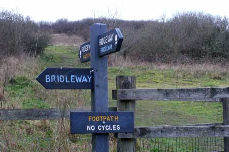 Signposts for the Ridgeway at a path leading up Lodge Hill