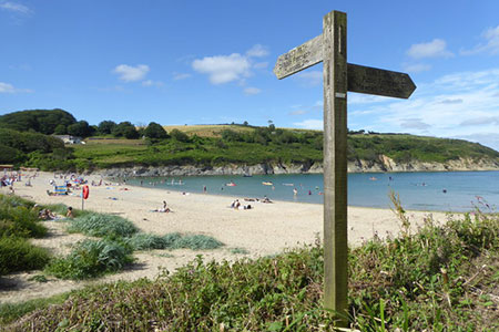 Coast Path signpost at Maenporth beach