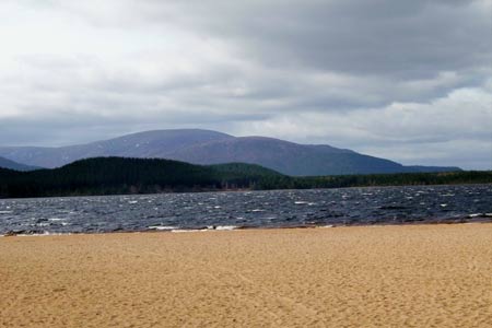 The sandy beach of Loch Morlic on a windy day