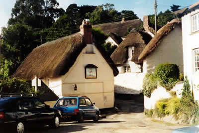 Thatched buildings in the village of Helford