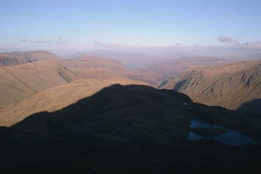 Shadow of North face of Great End across Borrowdale