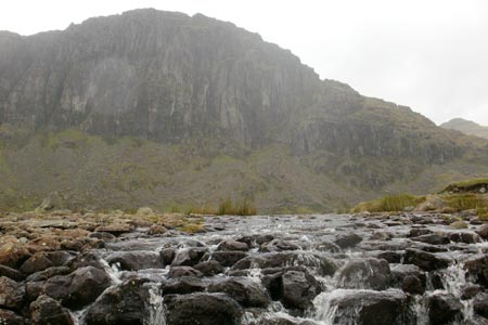 Outflow of Stickle Tarn with Pavey Ark beyond