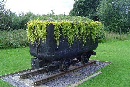 A mining waggon, now a decorative planter at Highley