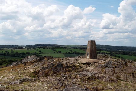 Trig-point amid rocky summit area of Beacon Hill