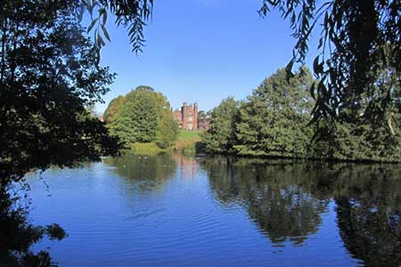 View across mere to Capesthorne Hall near Siddington
