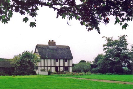 Timber cottage on the green at Beeston