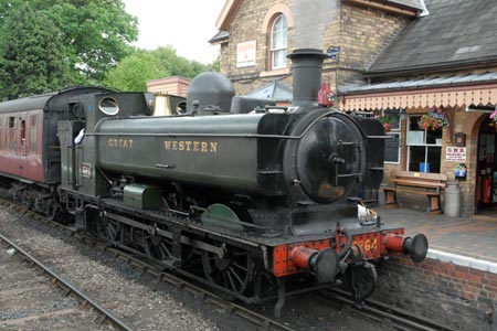 A steam train departs from Hampton Loade station