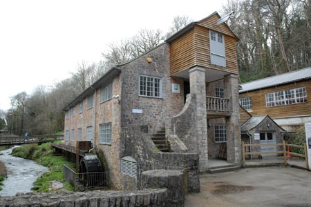 The restored watermill on the approach to Dartington