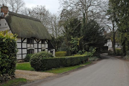 Thatched half-timbered cottages in Woolstone