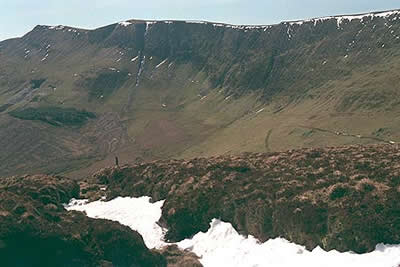 The dramatic eastern face looms above the valley of Cwm Maen Gwynedd