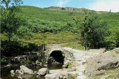 High Sweden Bridge with the crags of Low Pike beyond